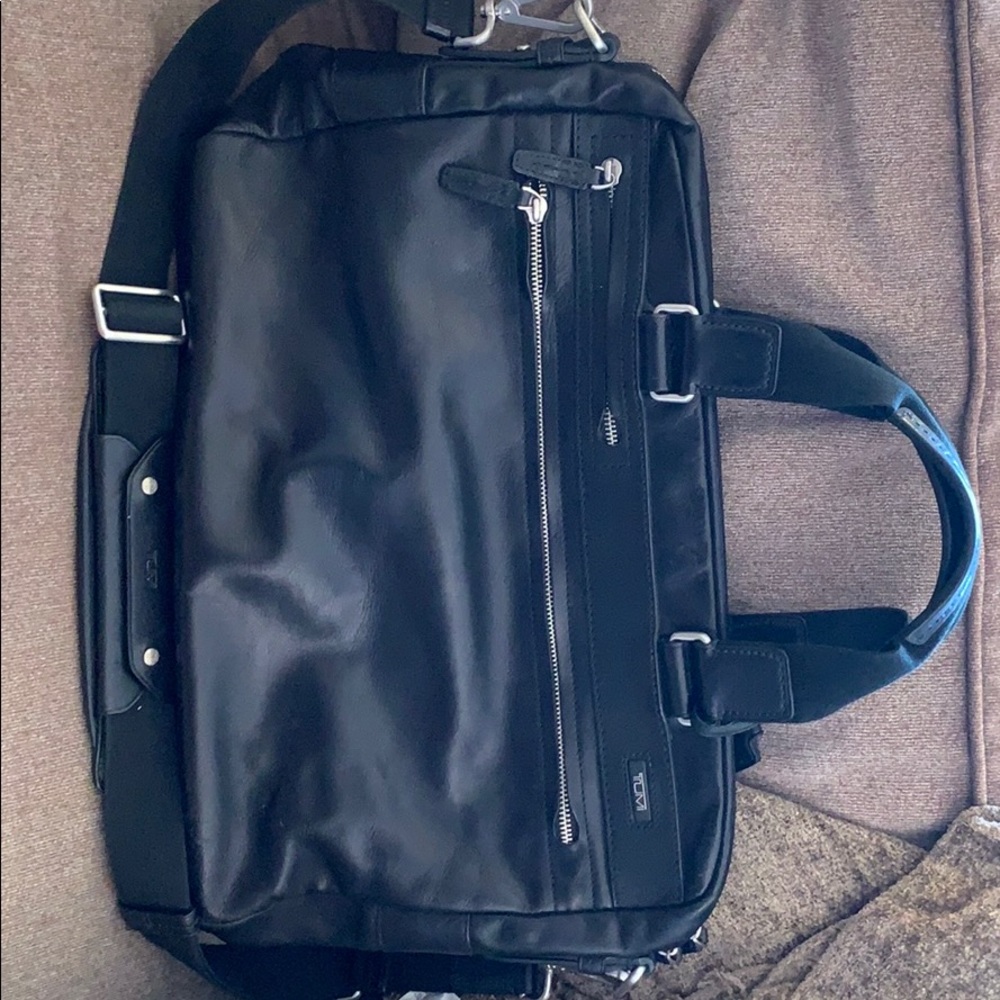 Tumi slim brief. leather, black. Mint condition.